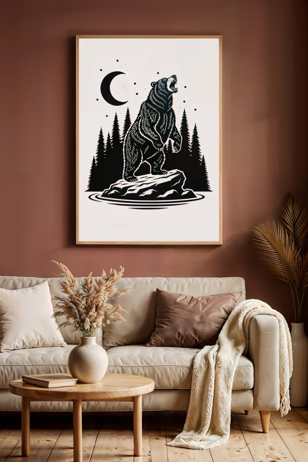 A striking black and white minimalist art print of a bear standing on a rock. The bear is roaring up at a crescent moon, surrounded by simple pine tree silhouettes. This 300 DPI digital download is perfect for rustic cabin decor or modern minimalist homes.