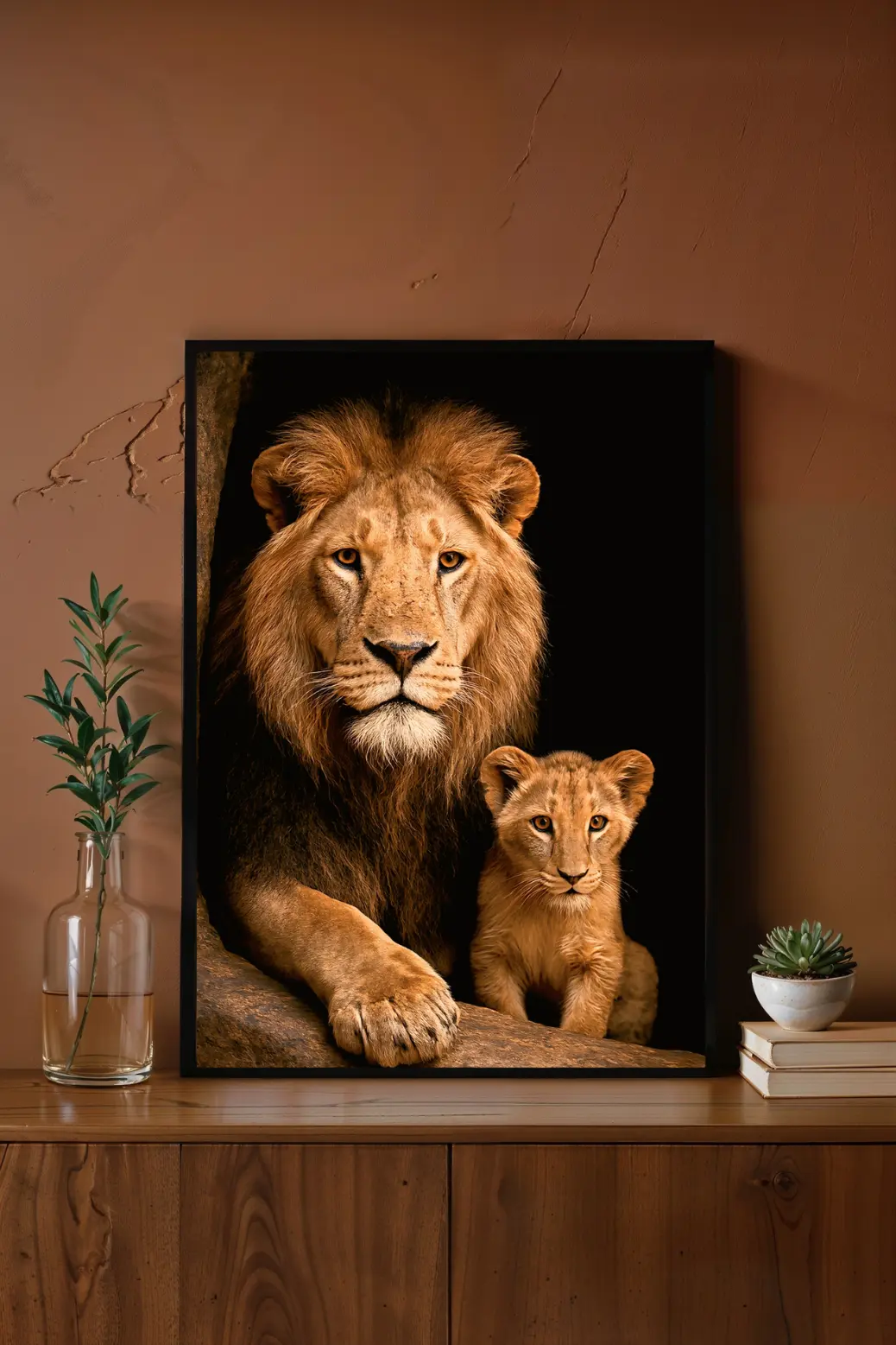 A high-resolution digital portrait of a male lion and his cub set against a solid black background. The dramatic lighting highlights the golden texture of the lion's mane and the cub's amber eyes. This vertical wildlife print creates a warm, majestic focal point for any room.