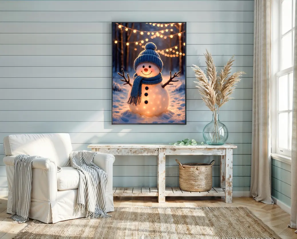 A cute and whimsical winter character illustration designed for children's room decor. The image features a friendly snowman with a soft, non-scary appearance, making it perfect for a baby nursery or toddler's bedroom during winter. The gentle golden lights provide a soothing, night-light quality to the artwork. The blue and gold color palette is gender-neutral and calming, while the festive theme brings the excitement of building a snowman indoors without the cold weather.